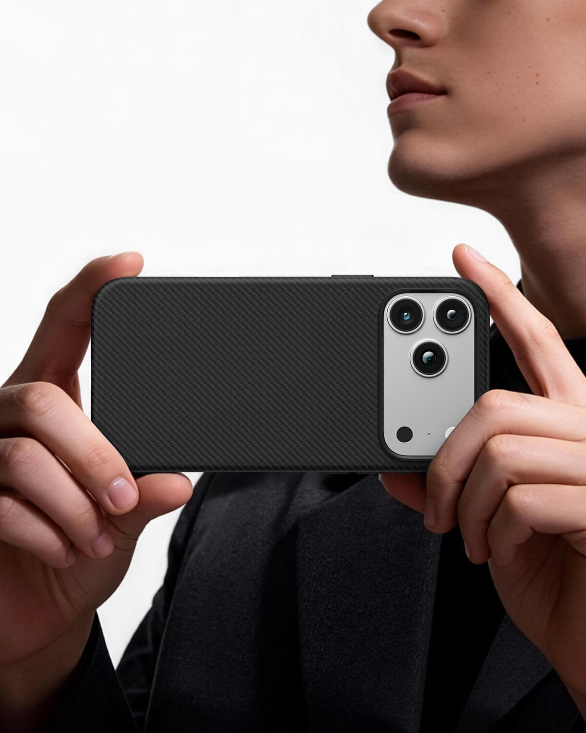 Person holding iPhone horizontally with carbon black aramid fiber case